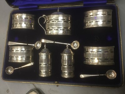 Lot 722 - Cased silver condiment set, together with silver photo frame, cased set of teaspoons, another set of teaspoons (unmarked) and a cased vanity set