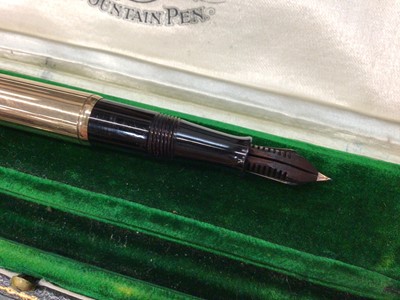 Lot 730 - Early 20th century 9ct gold Waterman's fountain pen with a 9ct gold mounted body, hallmarked London 1917, in original velvet lined tooled green leather box