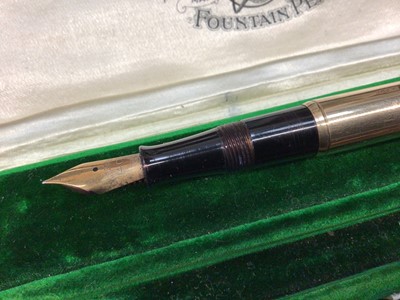Lot 730 - Early 20th century 9ct gold Waterman's fountain pen with a 9ct gold mounted body, hallmarked London 1917, in original velvet lined tooled green leather box