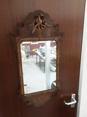 Lot 1013 - Georgian style walnut wall mirror with parcel gilt slip and Ho Ho bird decoration, 80.5cm x 43cm wide