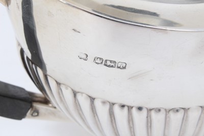 Lot 212 - 1920s silver half fluted teapot.