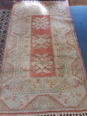 Lot 1113 - Rug with geometric decoration beige and peach ground, 217cm x 121cm