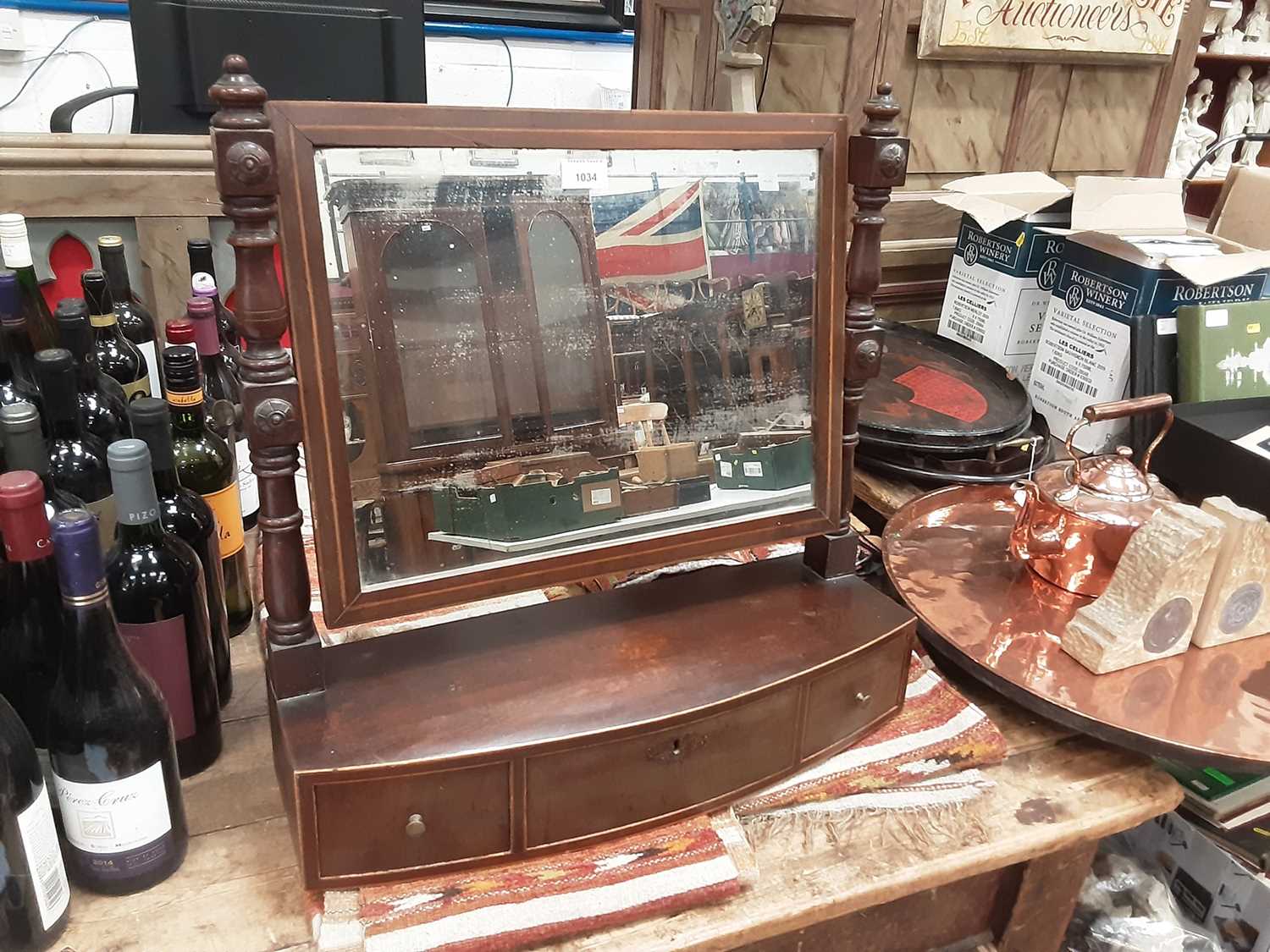 Lot 870 - Regency mahogany bowfront toilet mirror, with three drawers to the platform base, 55cm wide