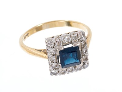 Lot 549 - Sapphire and diamond cluster ring with a square step cut blue sapphire surrounded by a border of single cut diamonds in platinum setting on 18ct yellow gold shank