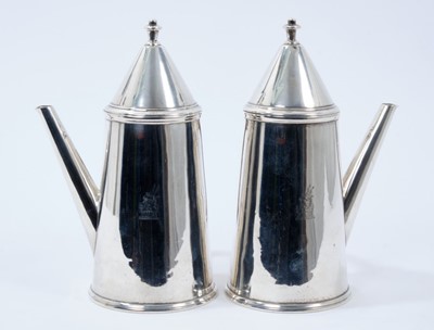 Lot 224 - Pair George V silver cafe au lait pots of tapering cylindrical form, with engraved armorial crests