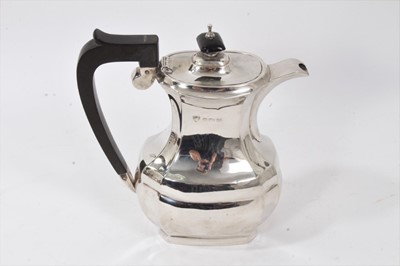 Lot 225 - 1930s silver coffee pot of facetted baluster form.