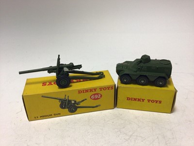 Lot 2161 - Dinky Military Armoured Car No 670, Armoured Personnel Carrier No 676, 5.5 Medium Gun No 692, Army 1 Ton Cargo Truck, all boxed (4)