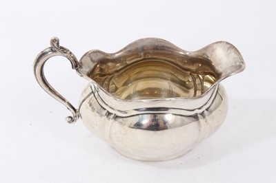 Lot 233 - George V silver twin handled sugar bowl and matching cream jug