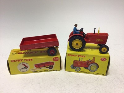 Lot 2181 - Dinky Massey-Harris Tractor No 300, Weeks Farm Trailer (Tipping) No 319, Hay Rake No 27K, all boxed (3)