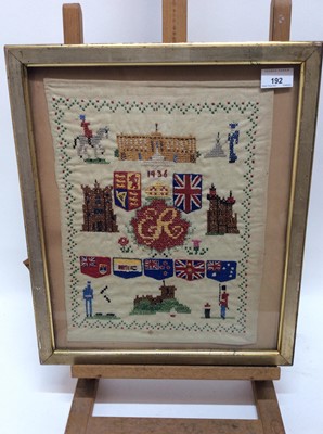 Lot 192 - Two 1930s Royal commemorative samplers depicting Buckingham Palace, flags and verse, each in glazed gilt frames, overall size 44cm x 38cm