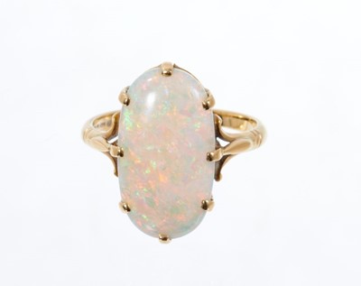 Lot 553 - Opal single stone ring with an oval opal measuring approximately 18.5mm x 10mm on 18ct yellow gold shank