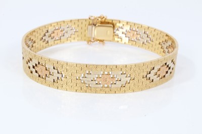 Lot 575 - Three-colour 18ct gold bracelet with articulated fancy links