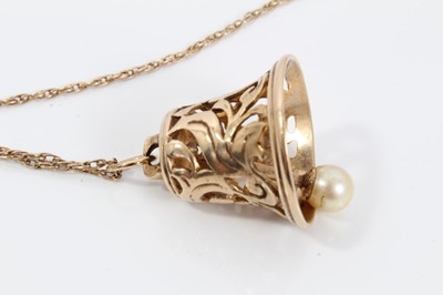 Lot 582 - 9ct gold ‘bell’ pendant on chain