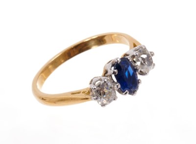 Lot 524 - Sapphire and diamond three stone ring