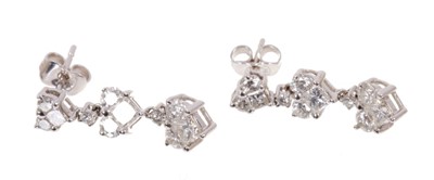 Lot 525 - Pair of diamond pendant earrings with heart shape clusters