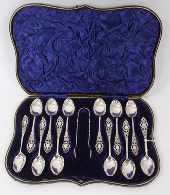 Lot 240 - Set of twelve Edwardian silver teaspoons and matching sugar tongs,  in a fitted case
