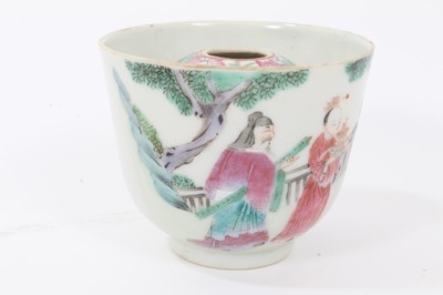 Lot 126 - Chinese Qing porcelain 'trick cup' with famille rose figural decoration and flying bat, 8.7cm in diameter