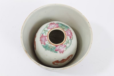 Lot 126 - Chinese Qing porcelain 'trick cup' with famille rose figural decoration and flying bat, 8.7cm in diameter