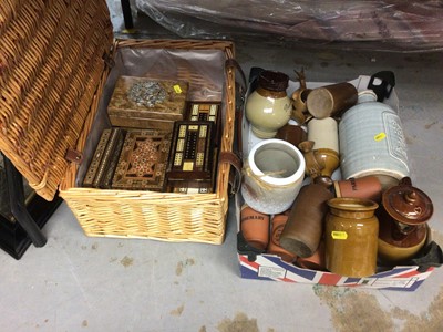 Lot 421 - Wicker hamper containing a quantity of wooden boxes and crib boards together with a box of stoneware bottles (2 boxes)