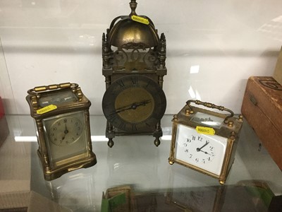 Lot 318 - Two carriage clocks together with a brass lantern style clock (3)