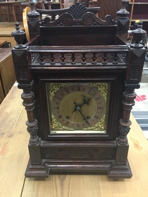 Lot 188 - Late 19th century mantel clock with 8 day striking movement by Winterhalder & Hofmeier, in carved oak case with galleried top and turned pilasters.