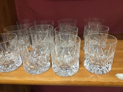 Lot 244 - Set of twelve vintage cut glass whisky tumblers, pair of Victorian cut and etched glass champagne coupes, pair of cut glass brandy balloons, cut glass ships decanter and three other cut glass decan...