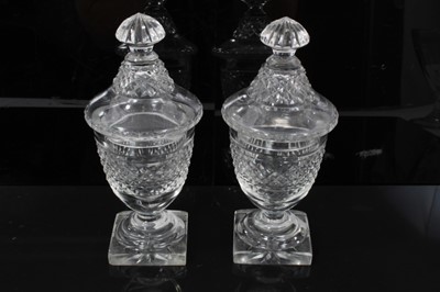 Lot 44 - Georgian cut glass butter tub and lid on stand, together with a pair of cut glass urns and covers