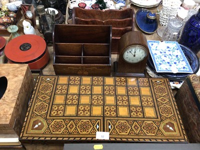 Lot 32 - Decorative inlaid backgammon box and accessories, inlaid stationary rack, another and an Edwardian inlaid mantel clock (4)