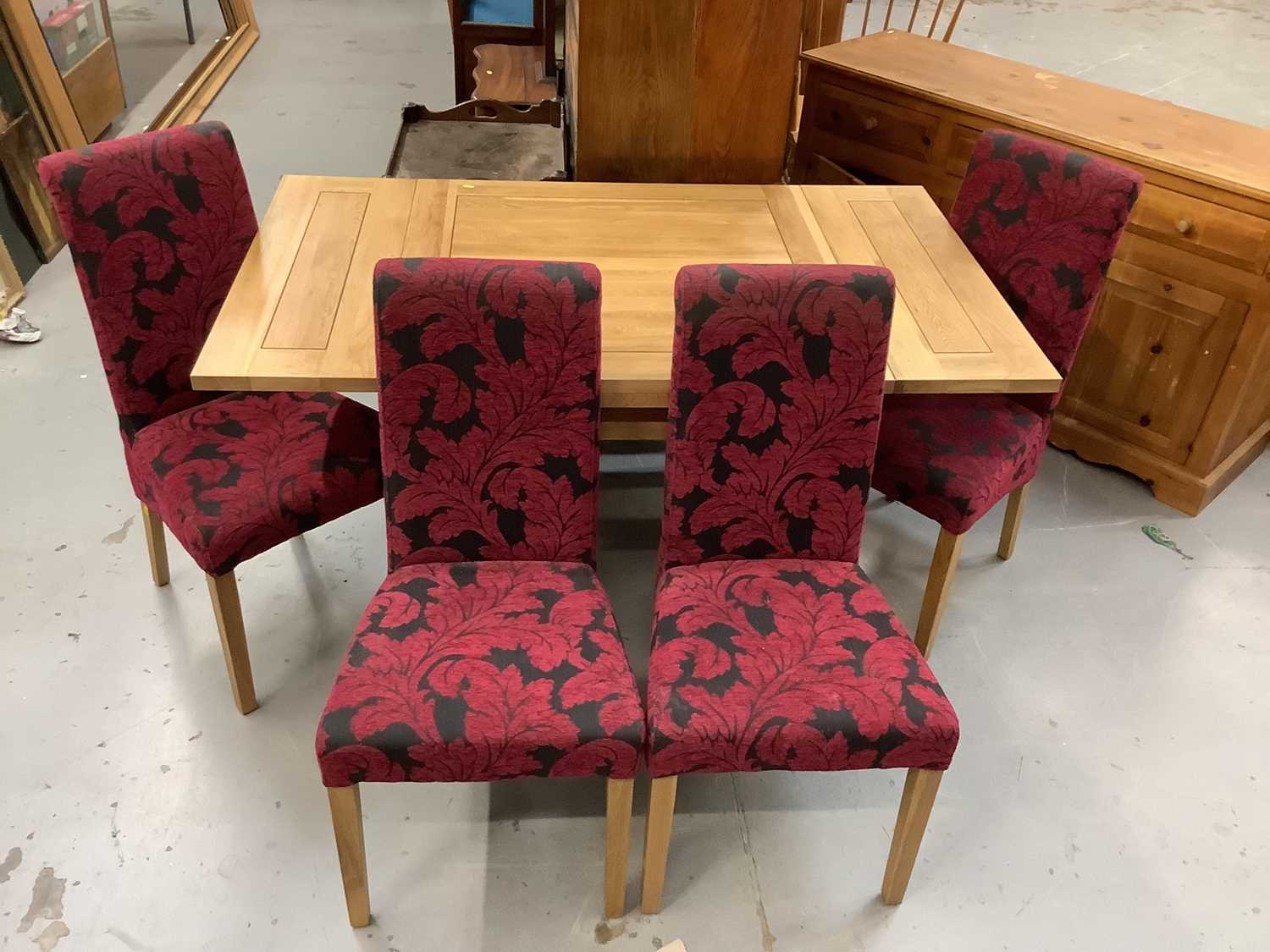 Lot 876 - Contemporary light oak square drawleaf  table together with four matching chairs with fuscia upholstery