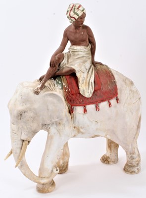 Lot 2353 - Late 19th century plaster model of a boy on an elephant