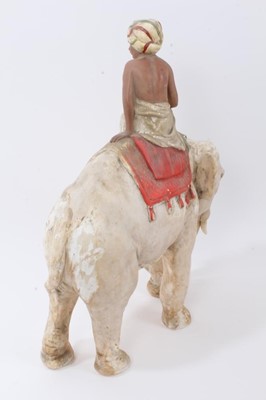 Lot 2353 - Late 19th century plaster model of a boy on an elephant