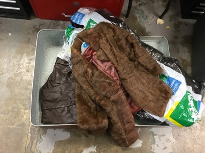 Lot 295 - Suitcase containing fur coats