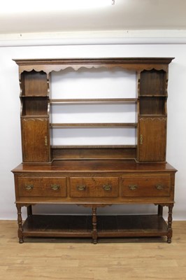 Lot 1448 - 18th century-style oak two height dresser with three drawers to base