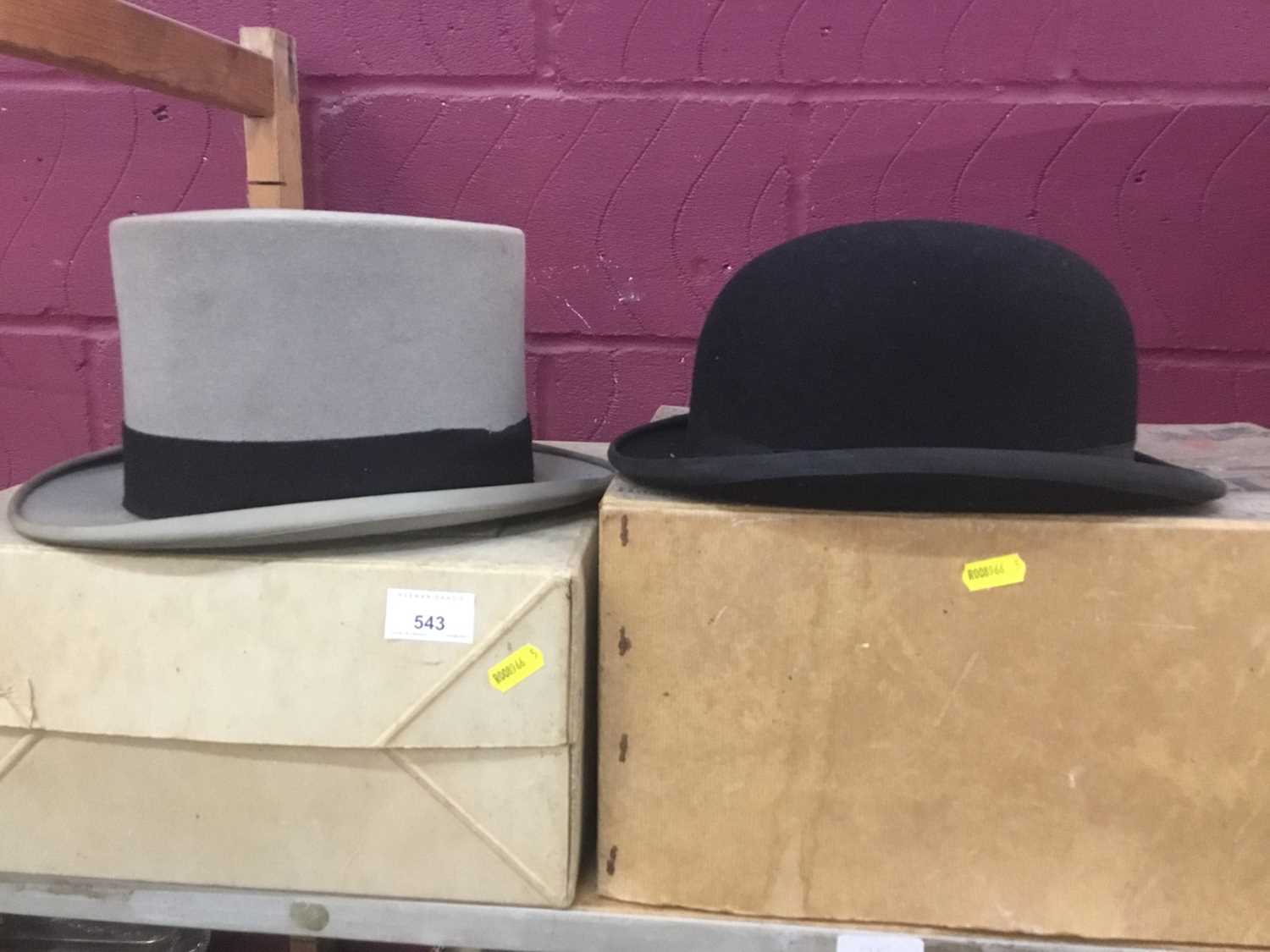 Lot 543 - Vintage bowler hat and a top hat in original card boxes