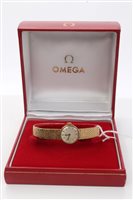 Lot 1601 - Omega ladies' gold (9ct) wristWatches on gold...