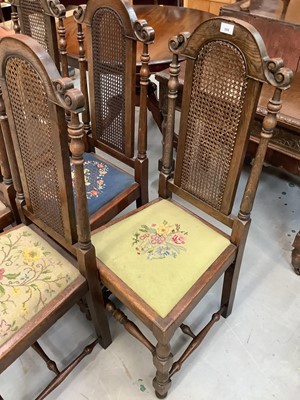Lot 888 - Set of five oak dining chairs with caned arched backs, four with tapestry seats