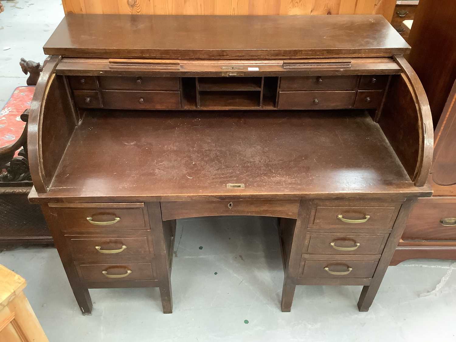 Lot 891 - Edwardian oak roll top desk