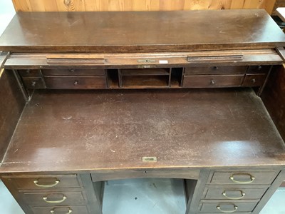 Lot 891 - Edwardian oak roll top desk