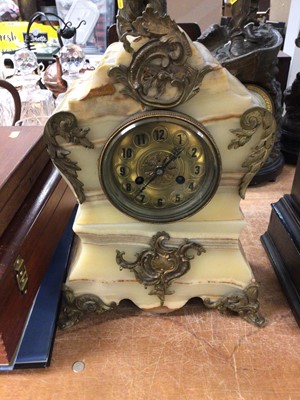 Lot 412 - Ornate onyx and gilt metal mantel clock