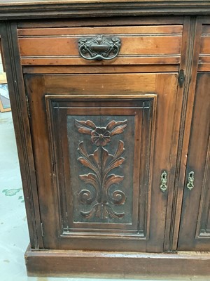 Lot 907 - Edwardian four-fold dressing screen and an Edwardian carved walnut cupboard enclosed by two carved panelled doors