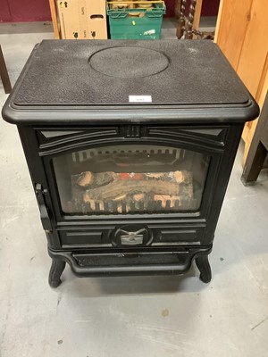Lot 897 - Modern electric heater in the form of a wood burner