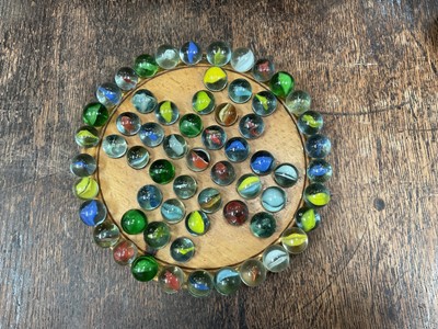 Lot 10 - Vintage solitaire board and a collection of marbles