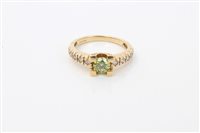 Lot 1579 - Gold (18ct) green diamond (probably heat...