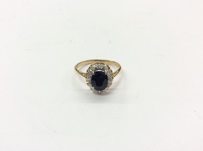 Lot 766 - 18ct gold sapphire and diamond cluster ring