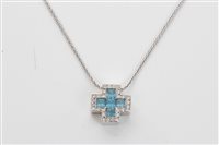 Lot 1582 - White gold (18ct) blue topaz and diamond set...