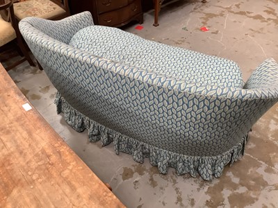 Lot 921 - Victorian-style kidney shaped two seater sofa upholstered in leaf patterned fabric on blue ground