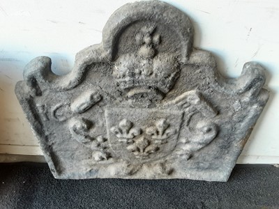 Lot 1049 - Antique cast iron fire back with heraldic motif