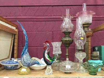 Lot 521 - Collection of oil lamps, glassware, and two Murano glass cockerels