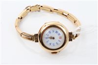 Lot 1584 - Yellow metal wristWatches with white enamel...