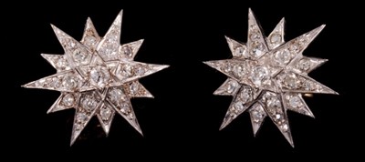 Lot 454 - Pair of diamond star earrings